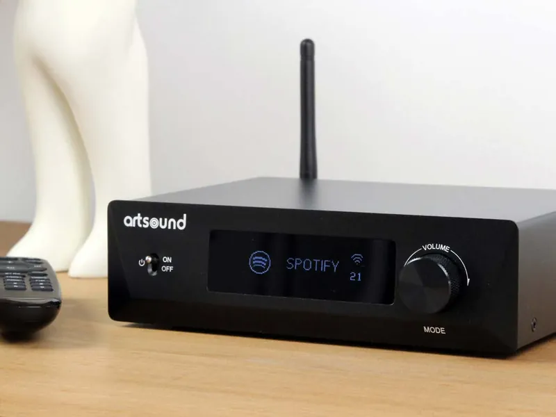 WiFi multiroom streaming amplifier with Spotify on a sideboard